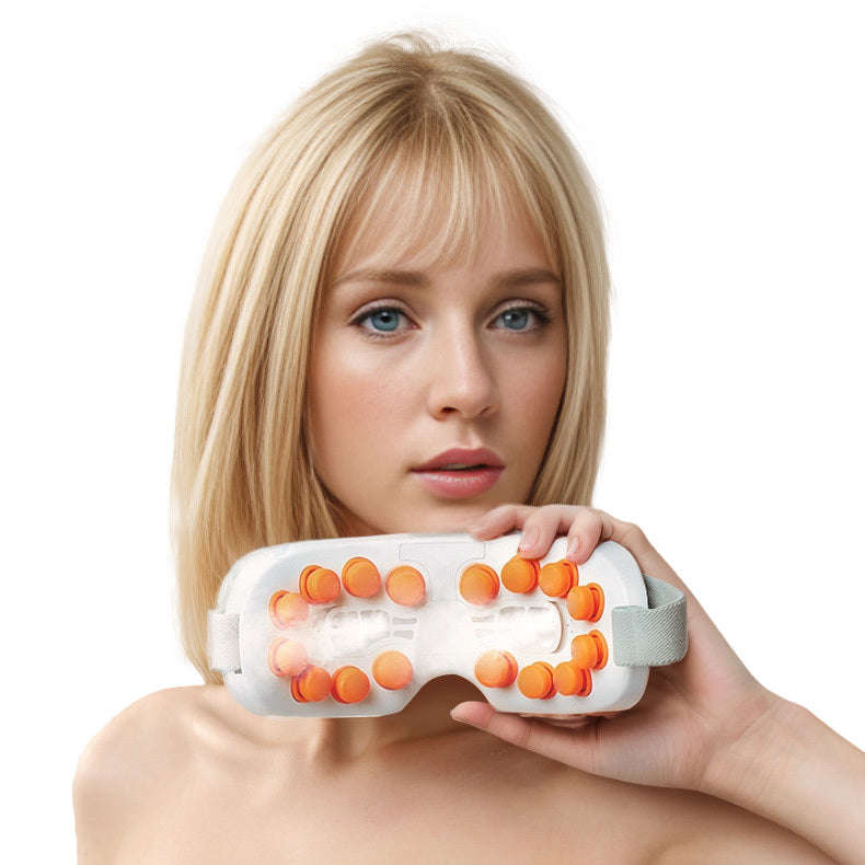 Eye massager with massage nodes around the eyes and temples